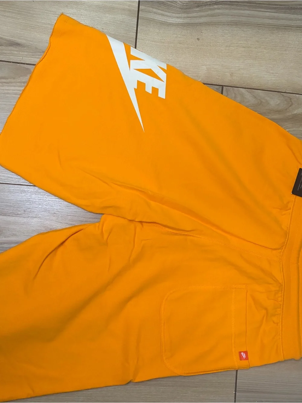 Nike Bright Orange Athletic Shorts with White Swoosh Tag